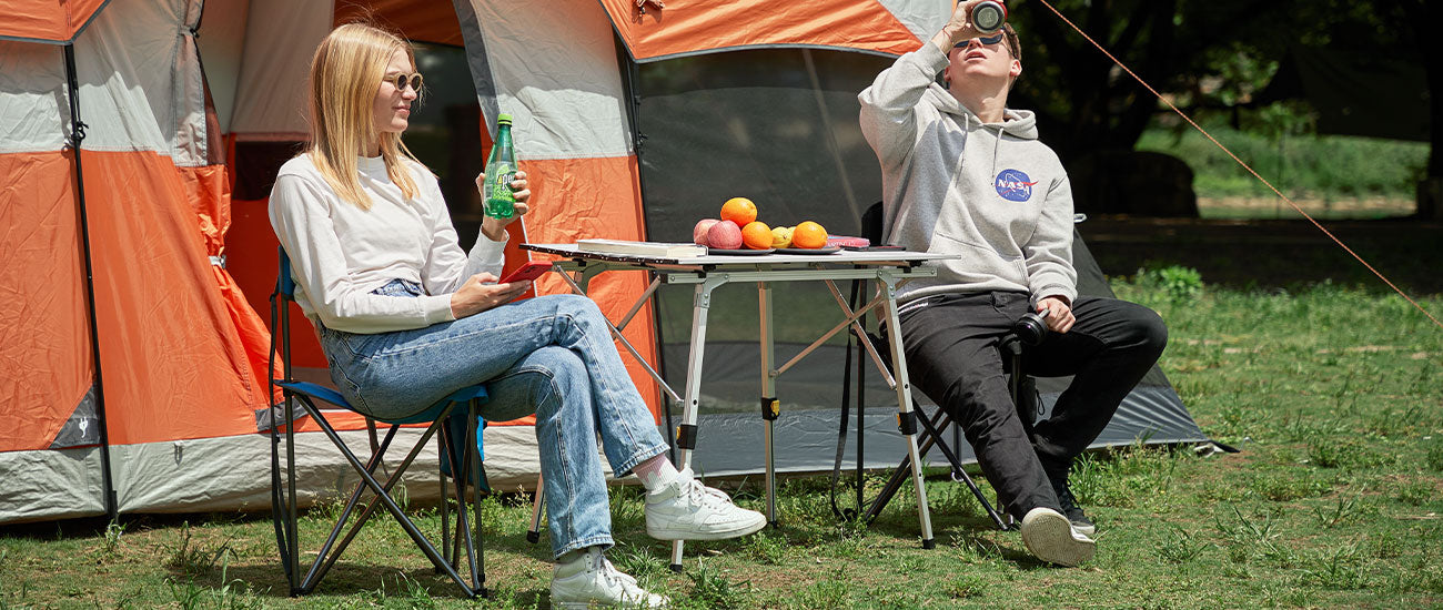 Two people sitting at Portal Outdoors's Oversized Action Chairs